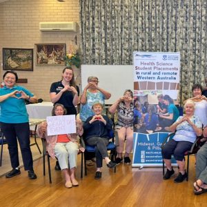A group of Seniors making the heart shape with their hands