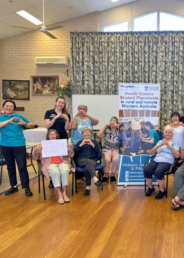 A group of Seniors making the heart shape with their hands