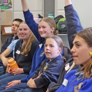 High school students raising their hands. Students were eager to show off their knowledge