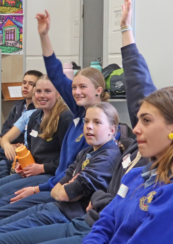 High school students raising their hands. Students were eager to show off their knowledge
