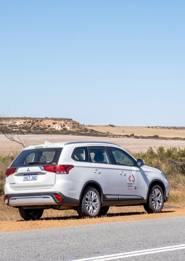 Frontier Services car on a remote outback road
