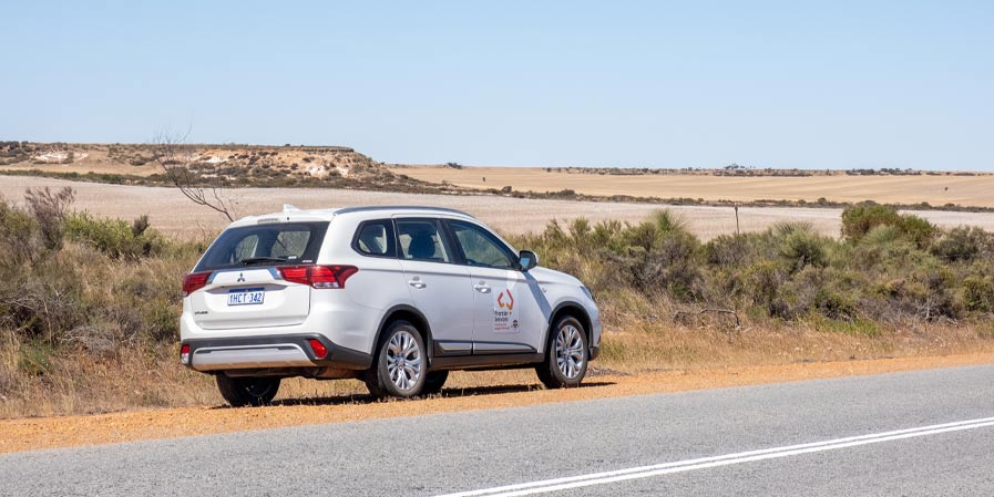Frontier Services car on a remote outback road