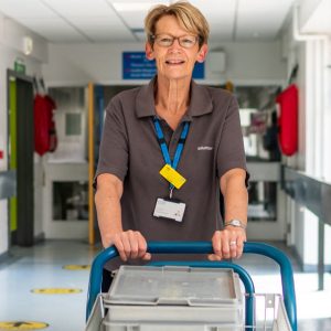 Senior woman pushing a trolley