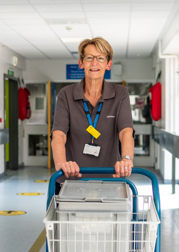 Senior woman pushing a trolley