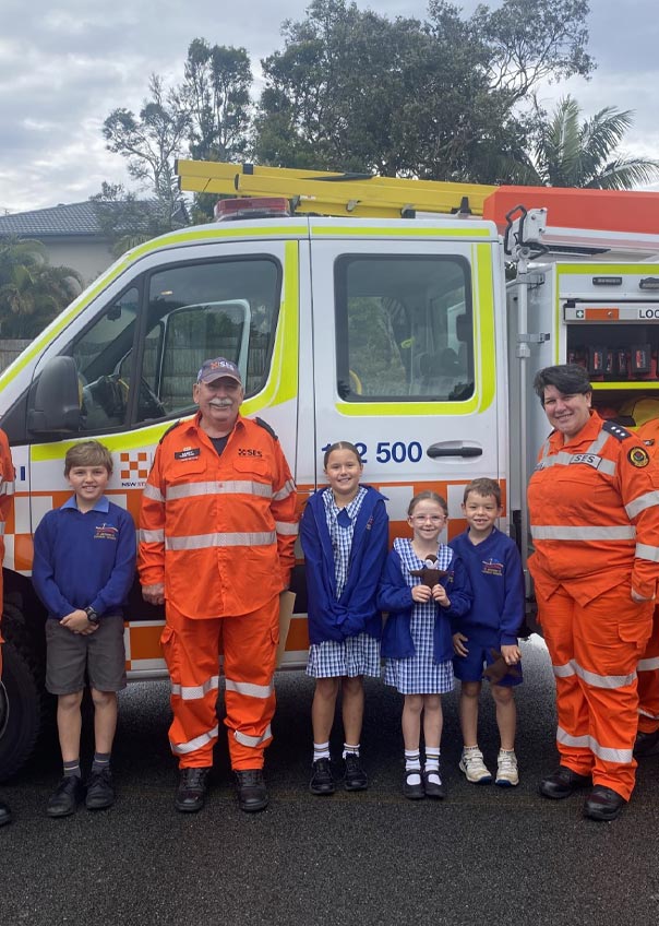 Primary school children with SES heroes who supported them through the floods.