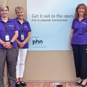 Staff next to the Mount Gambier Head to Health sign