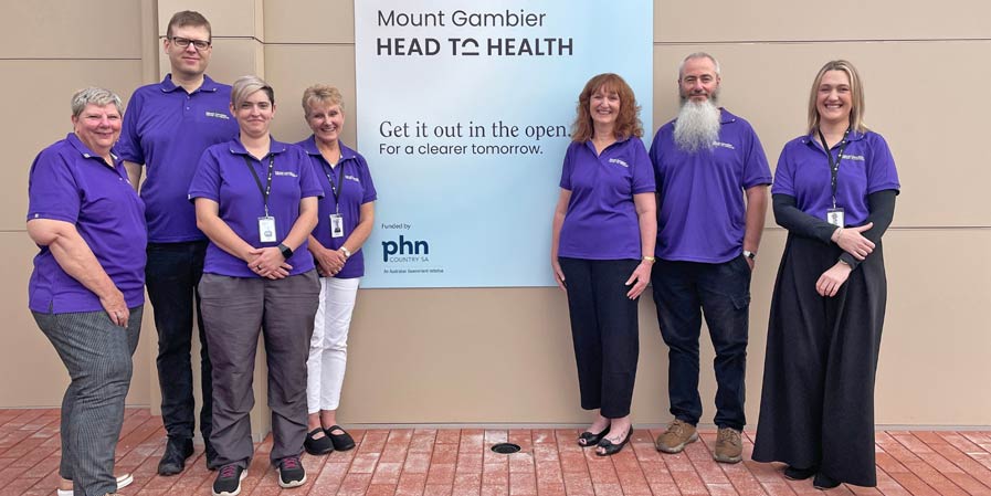 Staff next to the Mount Gambier Head to Health sign