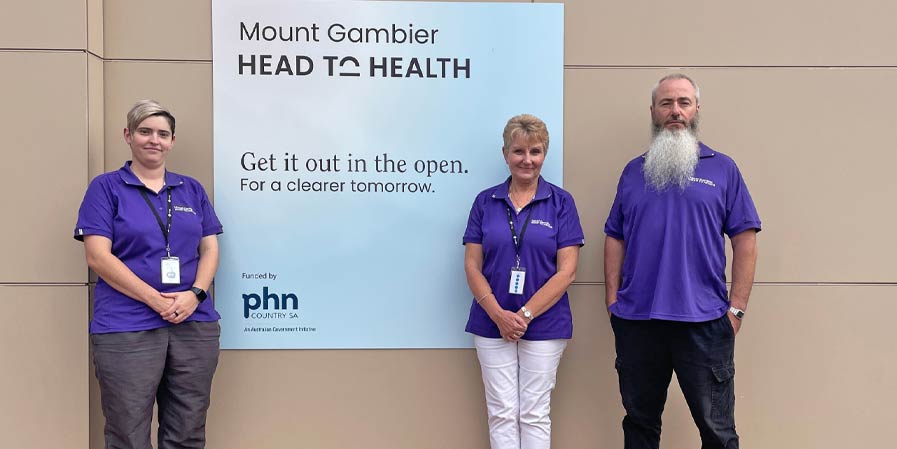 Staff next to the Mount Gambier Head to Health sign