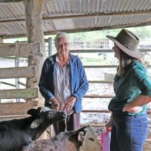 Rural Aid staff with farmer and potty calves’ photo - Supporting farmers through every season, Rural Aid lends a hand with practical help and a friendly presence in the yards.