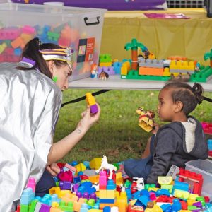 Captain Starlight with child and toys