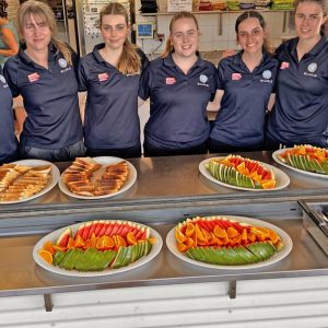 Volunteers with plates of food