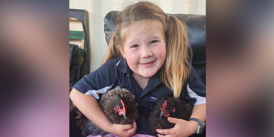 Billie with her beloved chickens