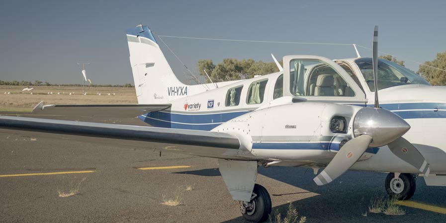 Small twin prop aircraft on runway