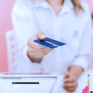 Receptionist return patients card