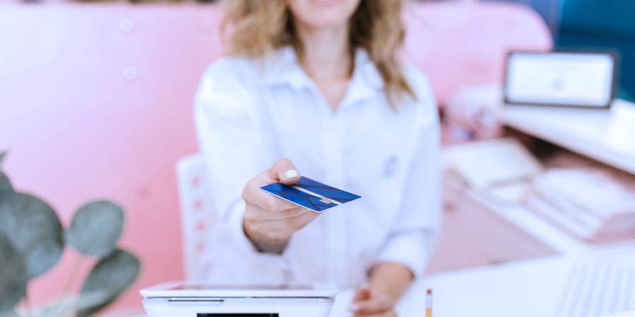 Receptionist return patients card