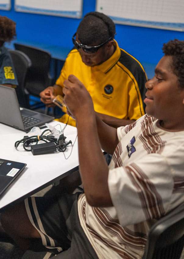 Teenage boys with computers